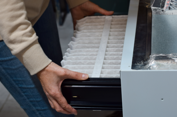 Replacing the central air furnace and air purification system filter in a home.